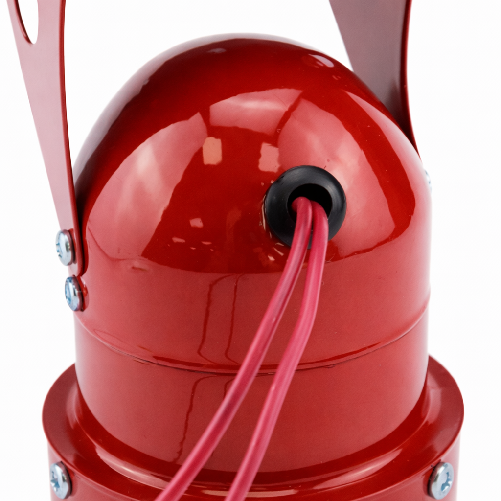 Red metal bell with a rope on a white background