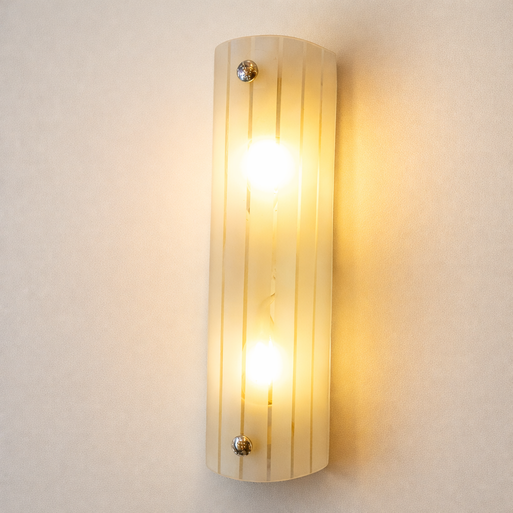 Modern wall light glass sconce with warm golden illumination