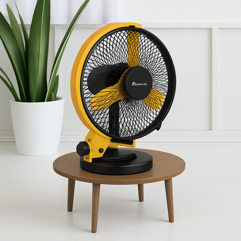 Yellow and black fan on a wooden table with a plant in the background