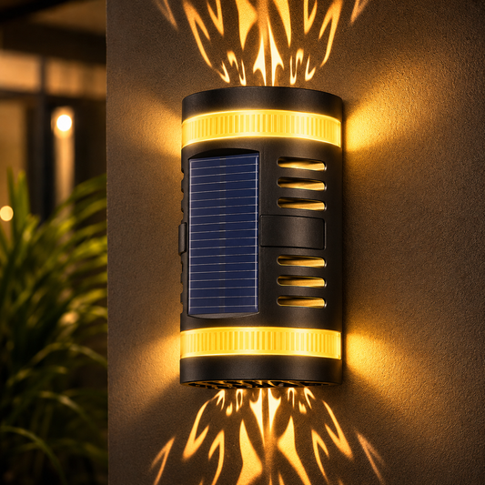 Solar-powered outdoor light fixture casting a warm glow on a wall.