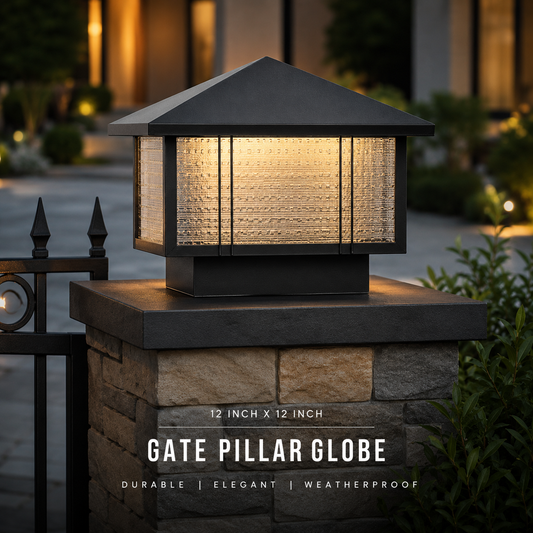 Outdoor gate pillar globe light fixture on a stone base with warm glow