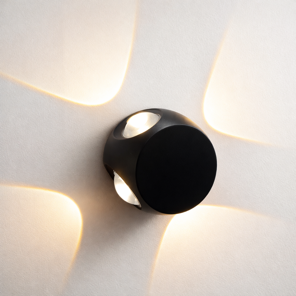 Modern black wall light fixture on a white wall