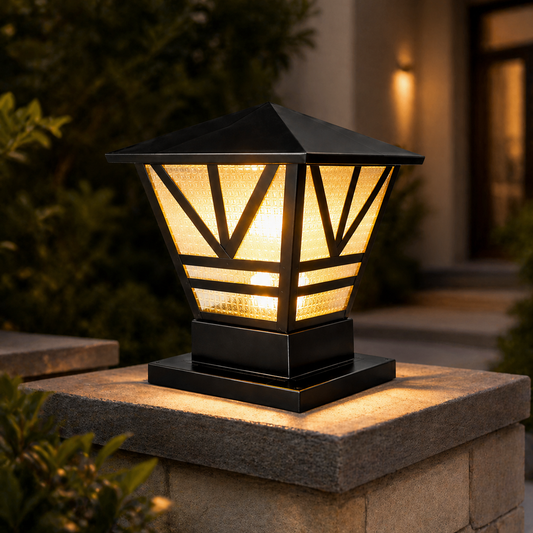 Decorative outdoor lamp on a stone pedestal with warm glow