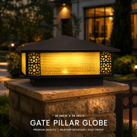 Glowing gate pillar globe light on a stone pedestal with a house in the background