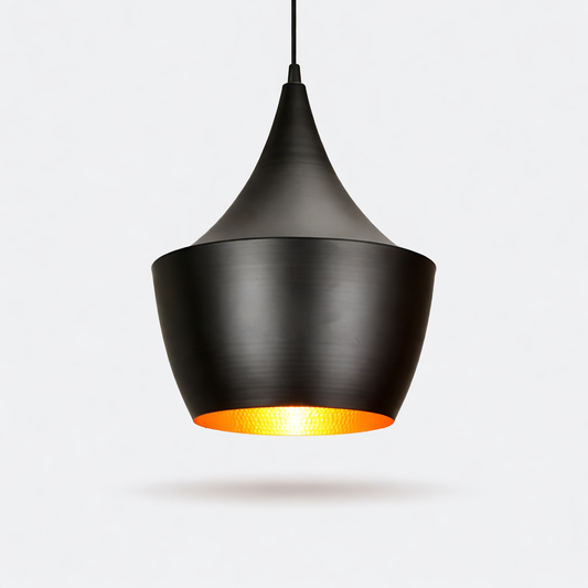 Modern black pendant light hanging above dining table interior