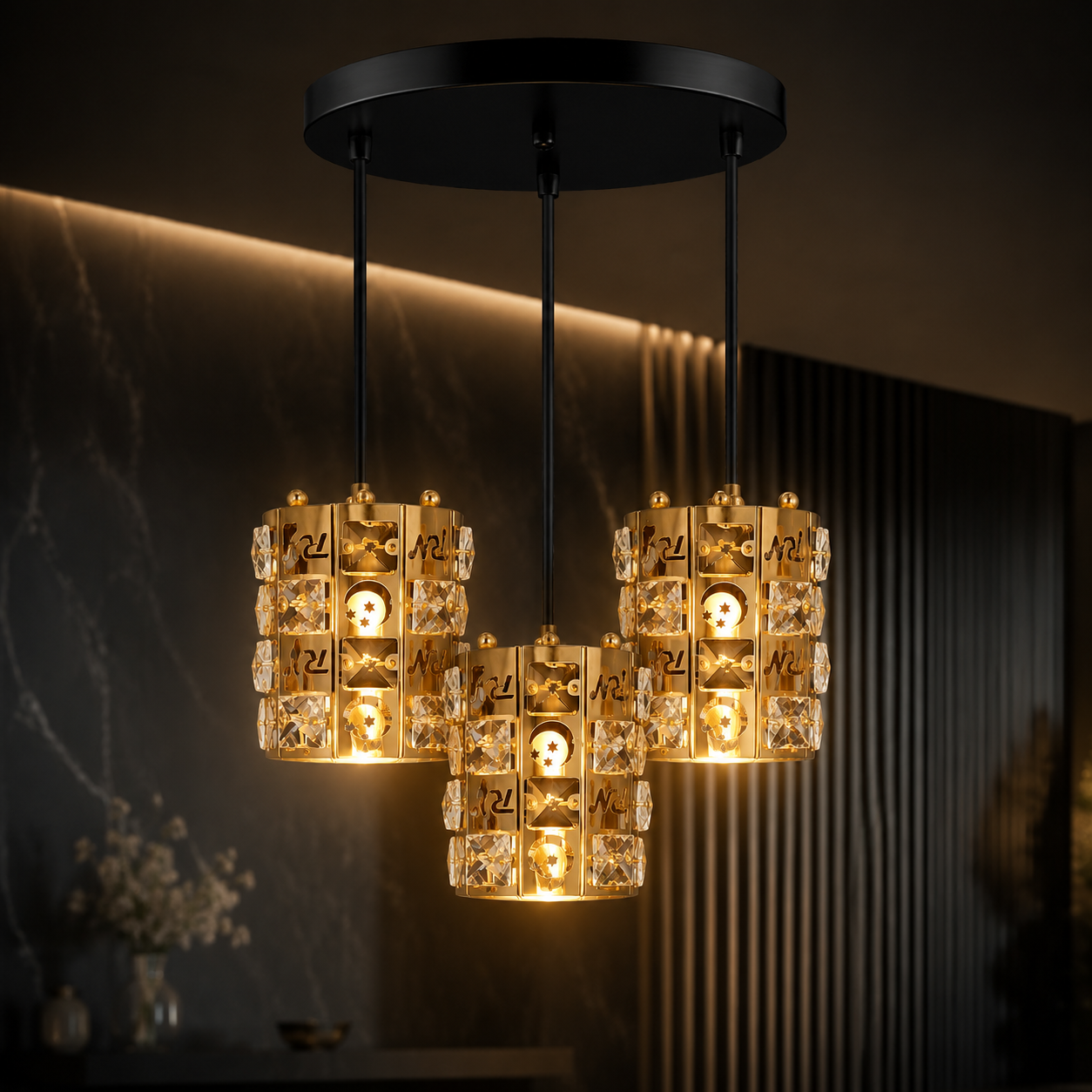 Three hanging pendant lights with crystal accents in a dimly lit room.