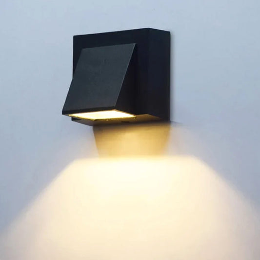 Modern black LED outdoor wall light with compact design