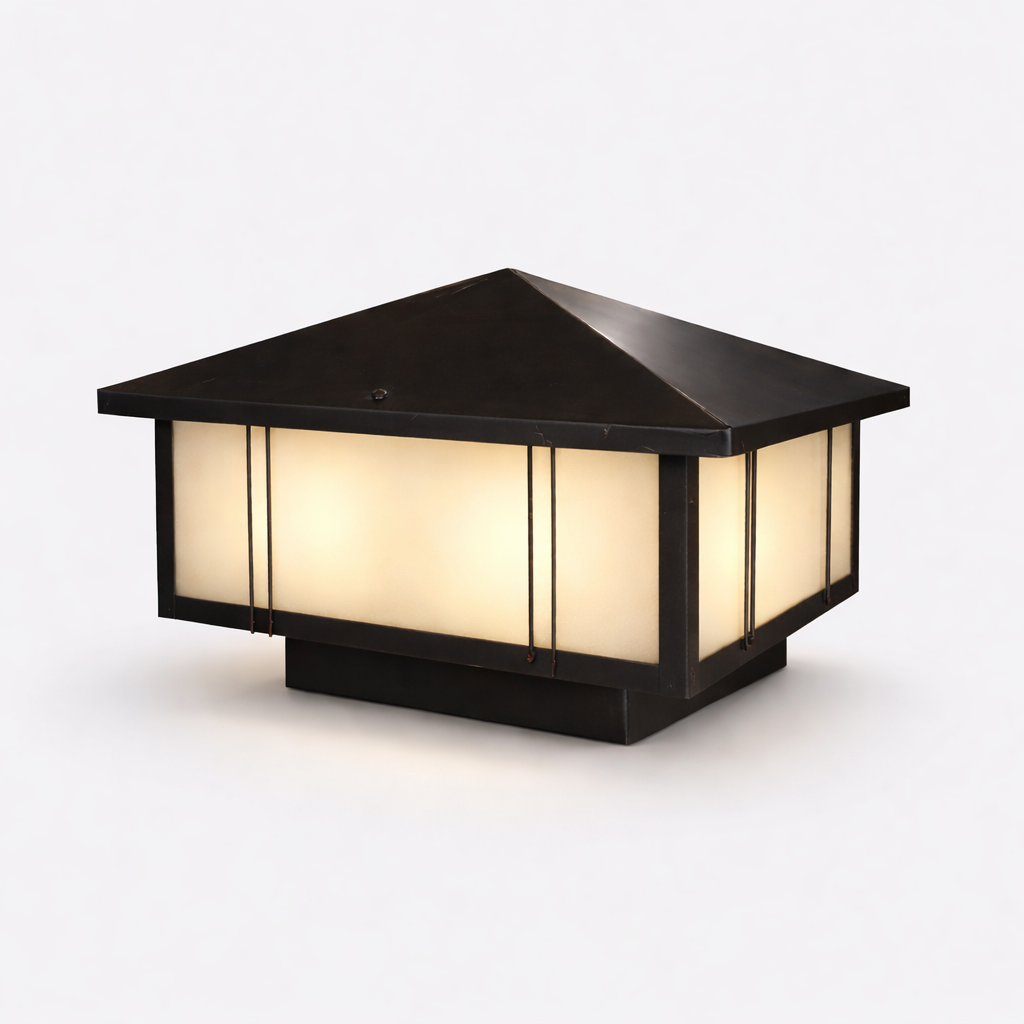 Black metal outdoor post light with warm LED glow