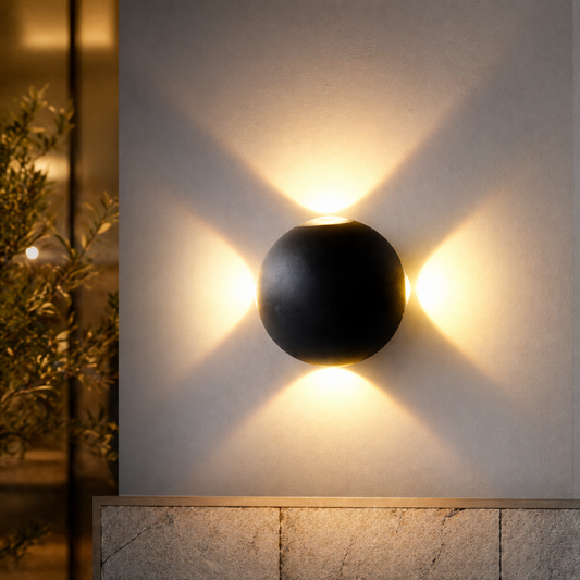 Modern black wall light fixture on a neutral wall with soft shadows