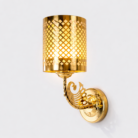 Gold wall sconce with decorative design on a white background