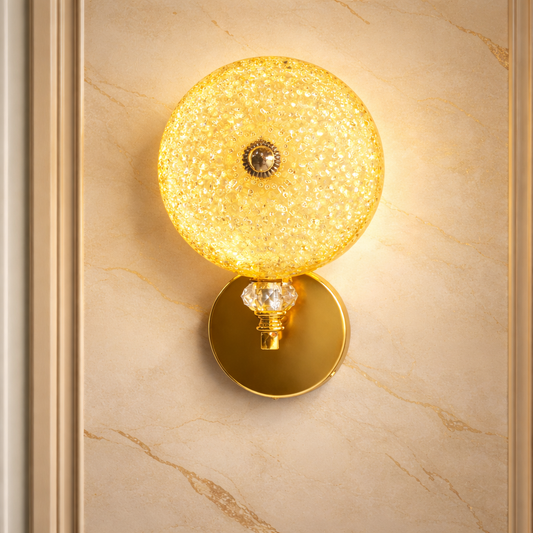 Gold crystal wall light mounted on modern indoor wall
