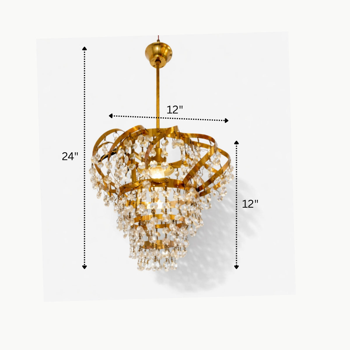 Gold chandelier with measurements on a white background