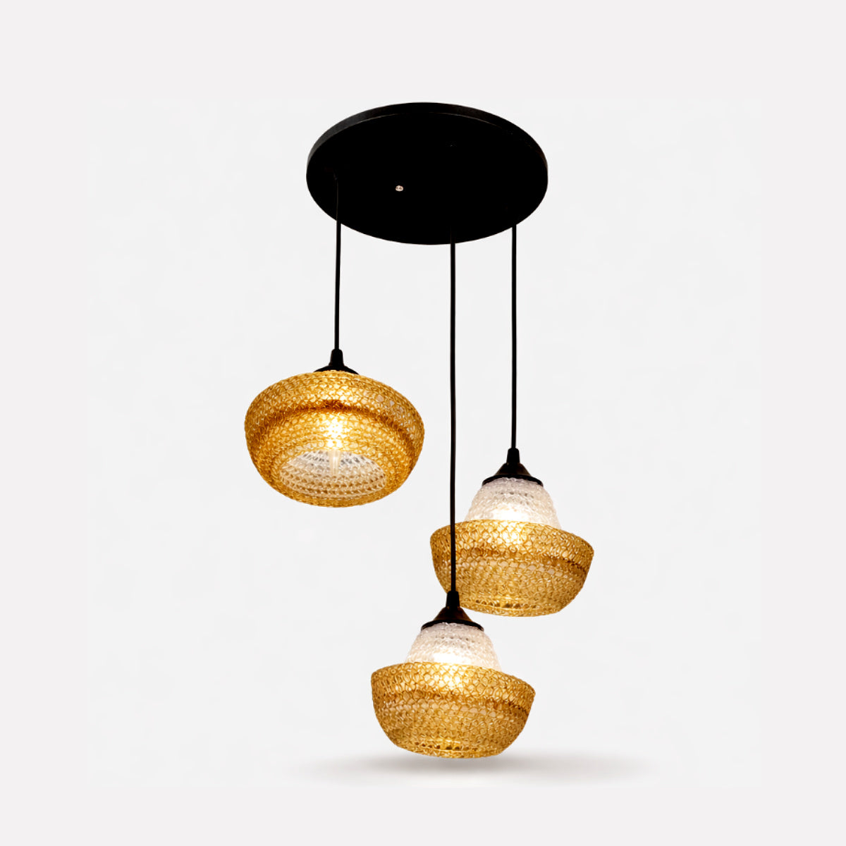 Three pendant lights with woven design on a white background