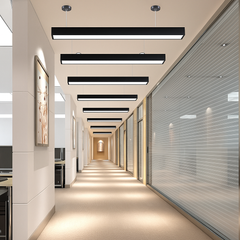 Modern office hallway with linear ceiling lights.
