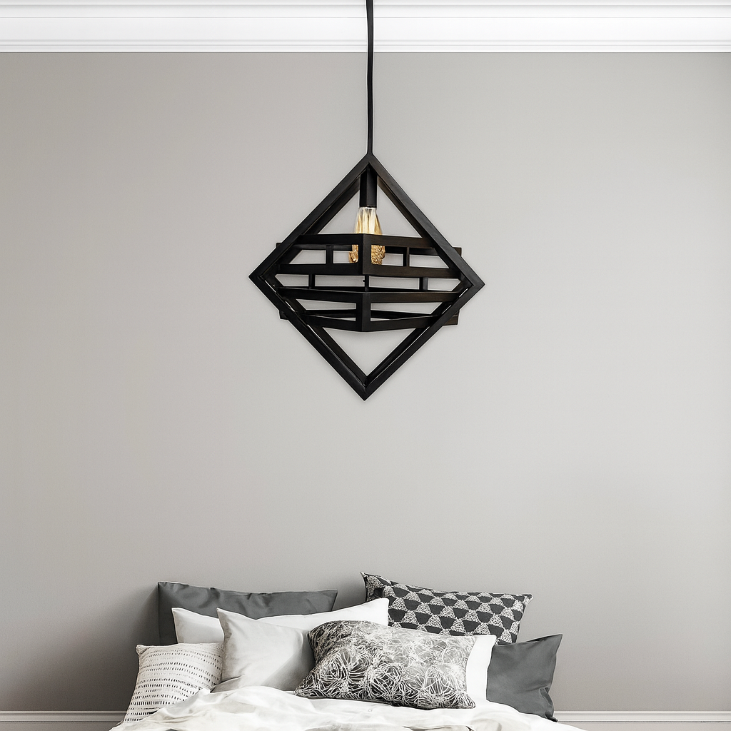 High-quality image of a modern bedroom featuring a black geometric pendant light hanging above a neatly arranged bed with gray and white pillows, enhanced with natural shadows and professional lighting for a sleek interior design look."