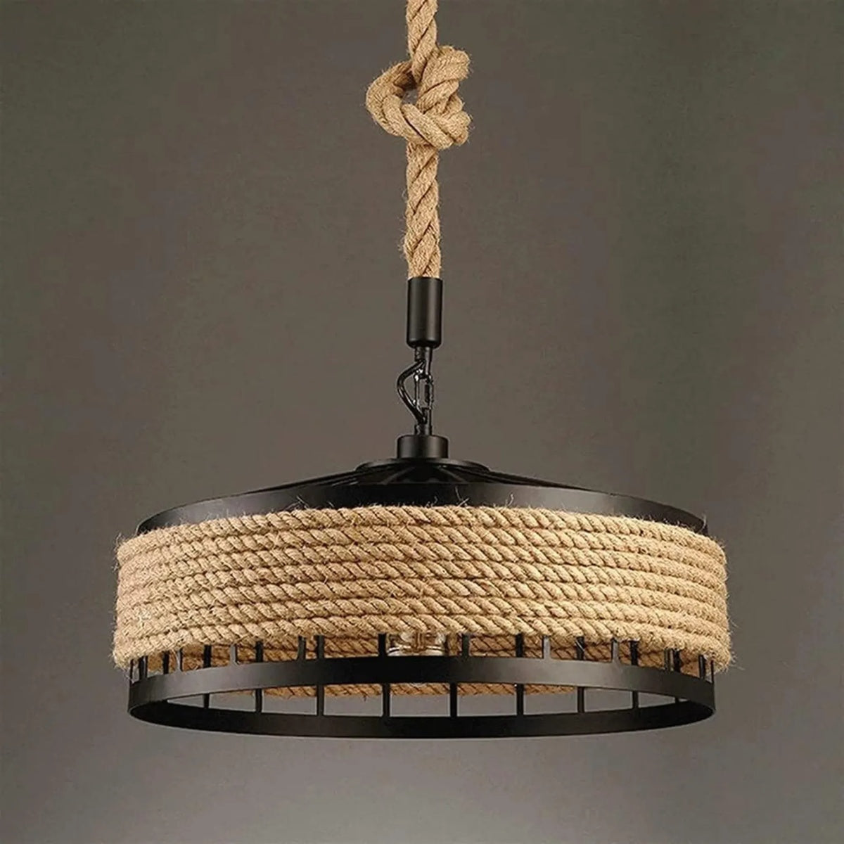 Industrial rope and iron ceiling light hanging in living area.