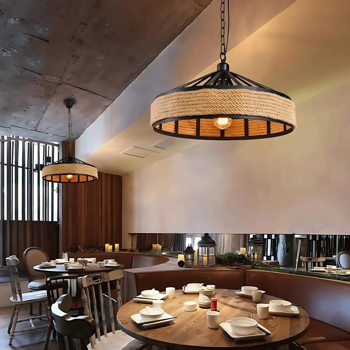 Dining area with rustic pendant lights and wooden tables.