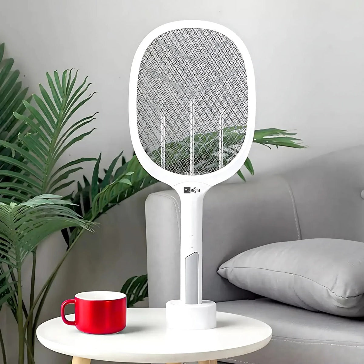 USB rechargeable mosquito killer racket placed on a table. 1
